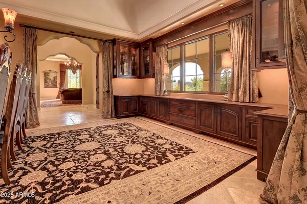 a living room with a flat screen tv and a fireplace