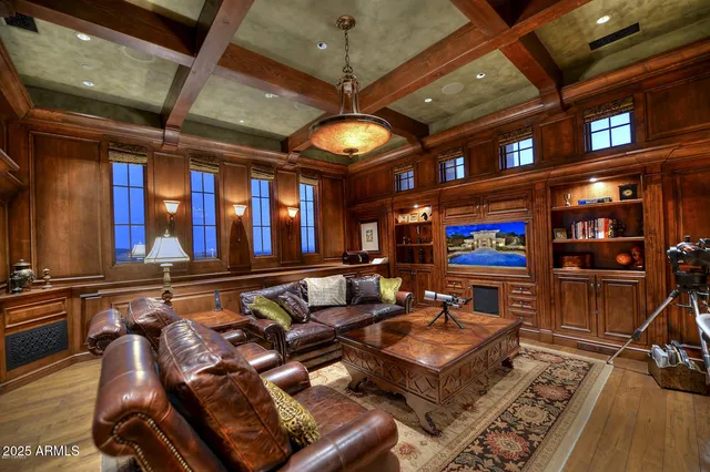 a living room with lots of furniture and a flat screen tv