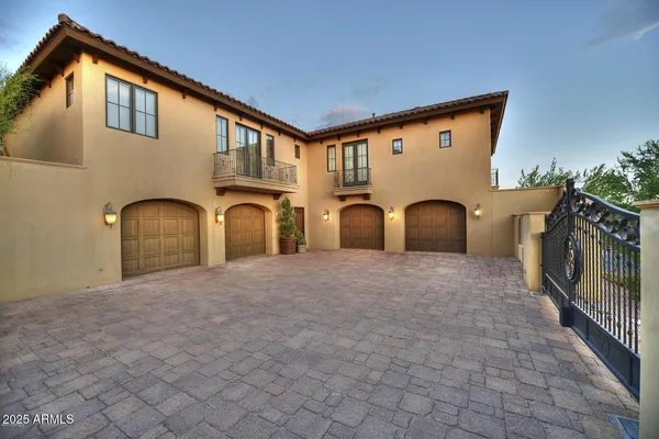 a front view of a house with yard and a garage
