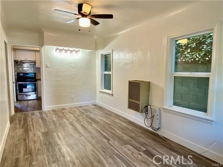 314 Coronado Avenue, Unit C Long Beach, CA 90814 - Photo 4 of 19 a view of a livingroom with wooden floor and a ceiling fan