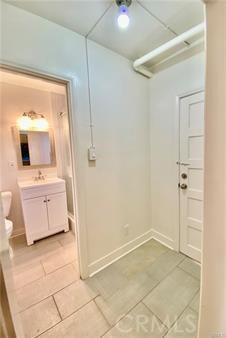 314 Coronado Avenue, Unit C Long Beach, CA 90814 - Photo 7 of 19 a bathroom with a sink a toilet and mirror