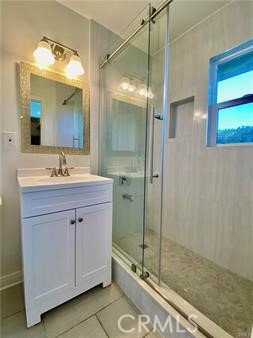 314 Coronado Avenue, Unit C Long Beach, CA 90814 - Photo 9 of 19 a bathroom with a shower sink and mirror