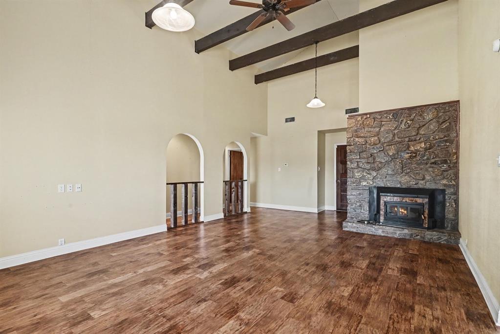 332 Cook Road Willow Park, TX 76087 - Photo 6 of 26 Wood-finish flooring with recessed lighting, an arched doorway, and a ceiling fan