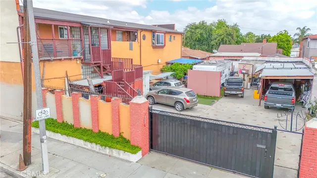 a view of a house with a patio and a yard
