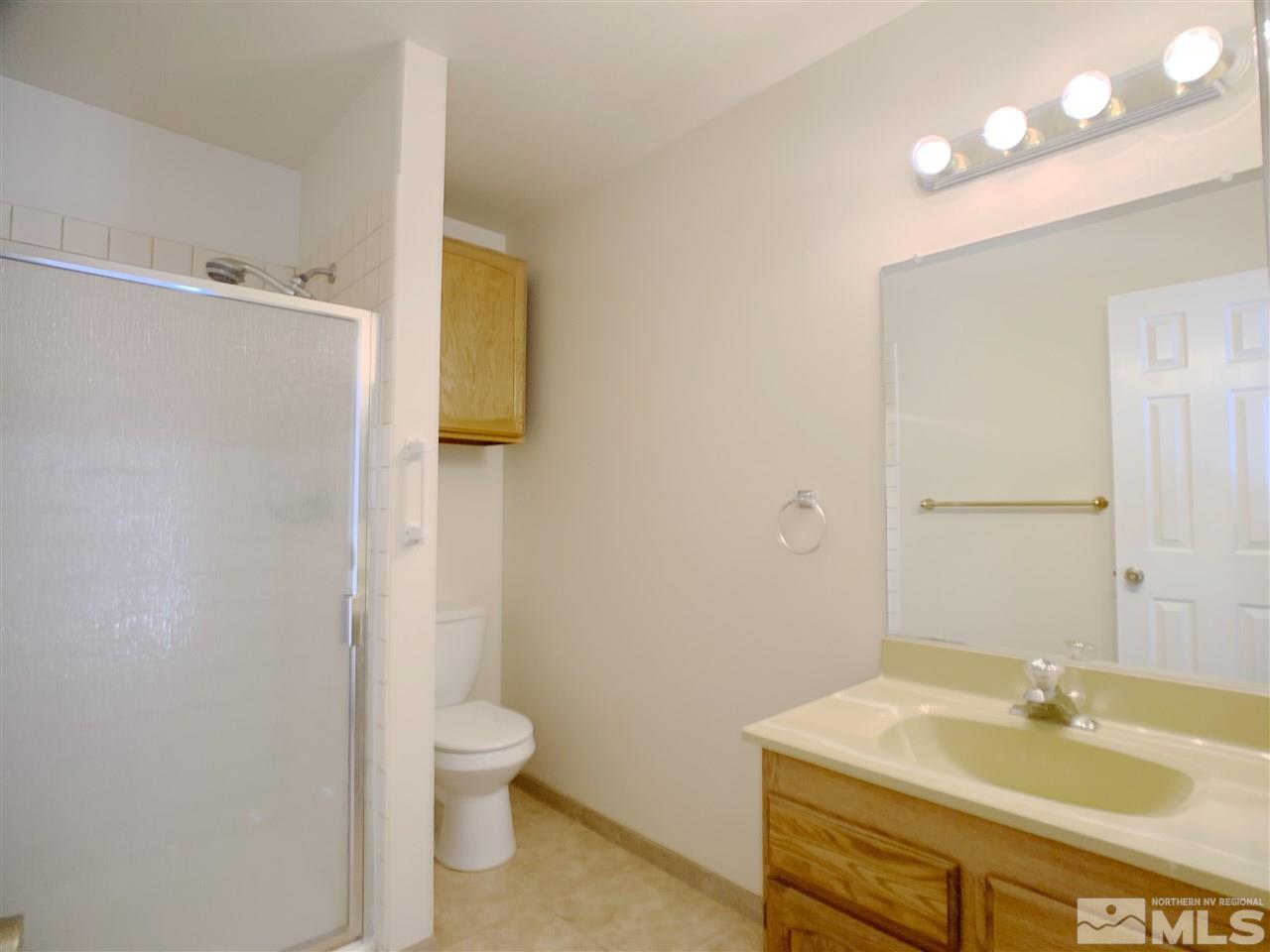 2101 Escalera Way Reno, NV 89523 - Photo 11 of 17 a bathroom with a sink toilet and shower