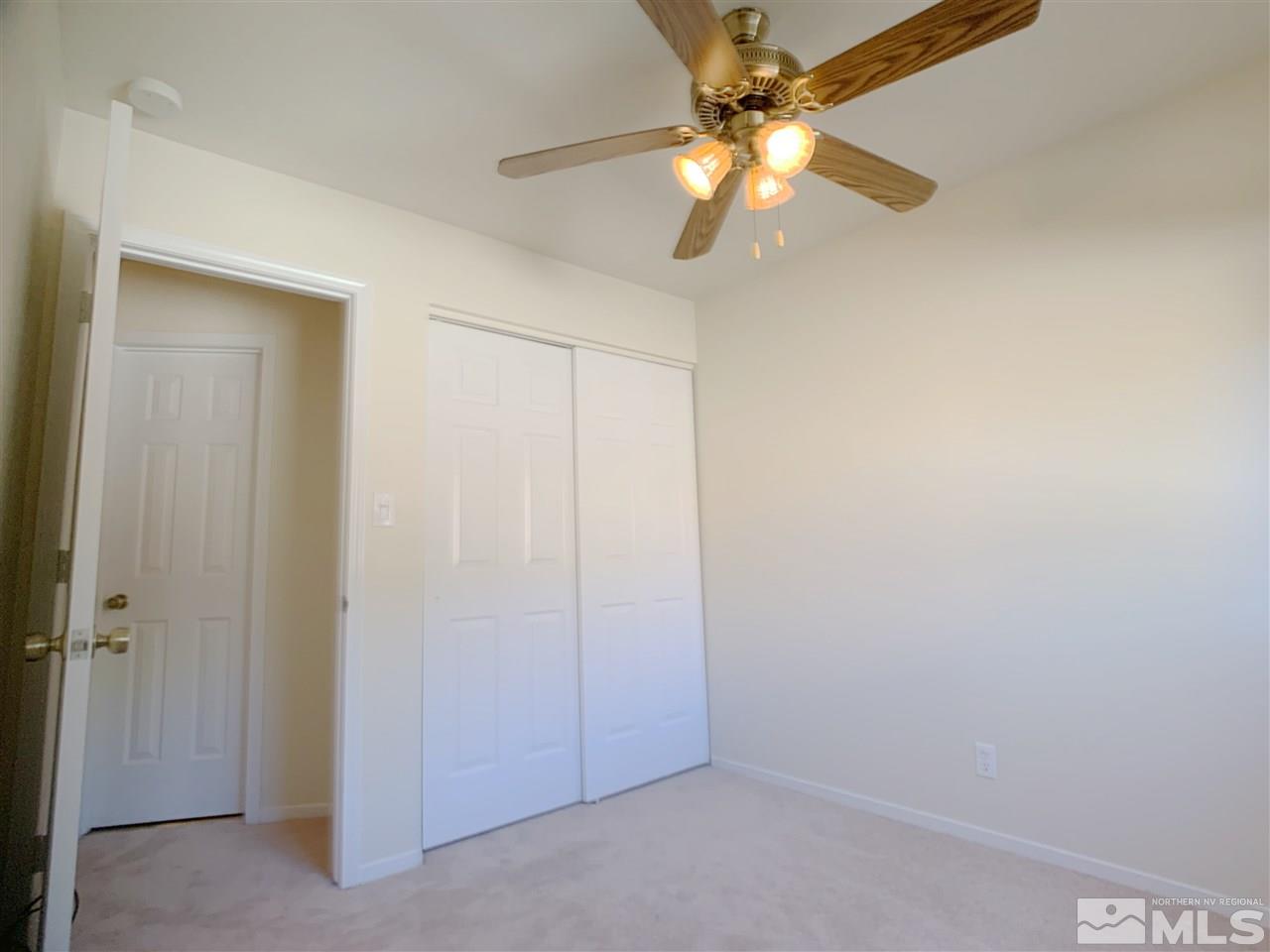 2101 Escalera Way Reno, NV 89523 - Photo 13 of 17 an empty room with a fan and a fan