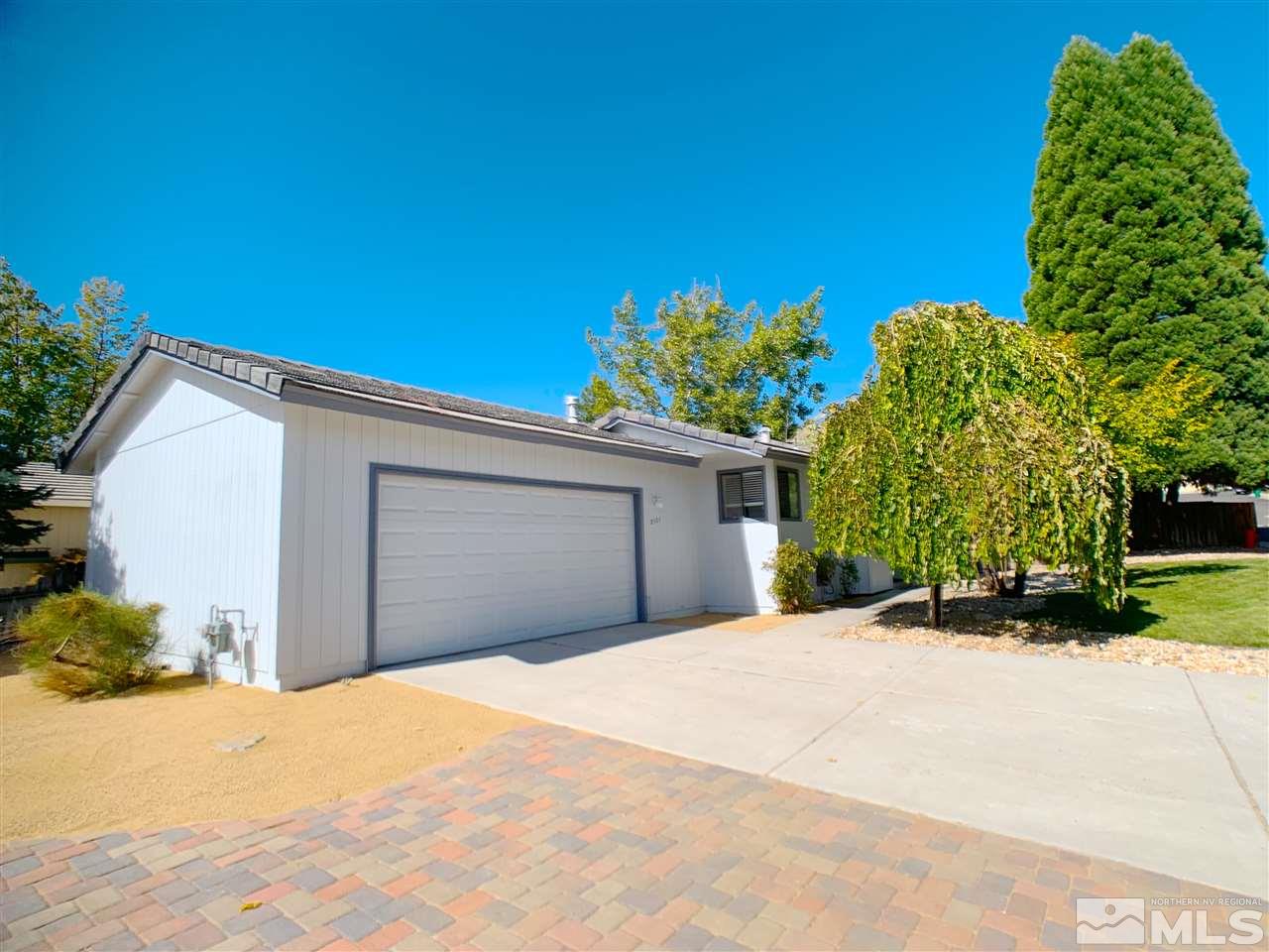 2101 Escalera Way Reno, NV 89523 - Photo 2 of 17 a front view of a house with a yard and garage