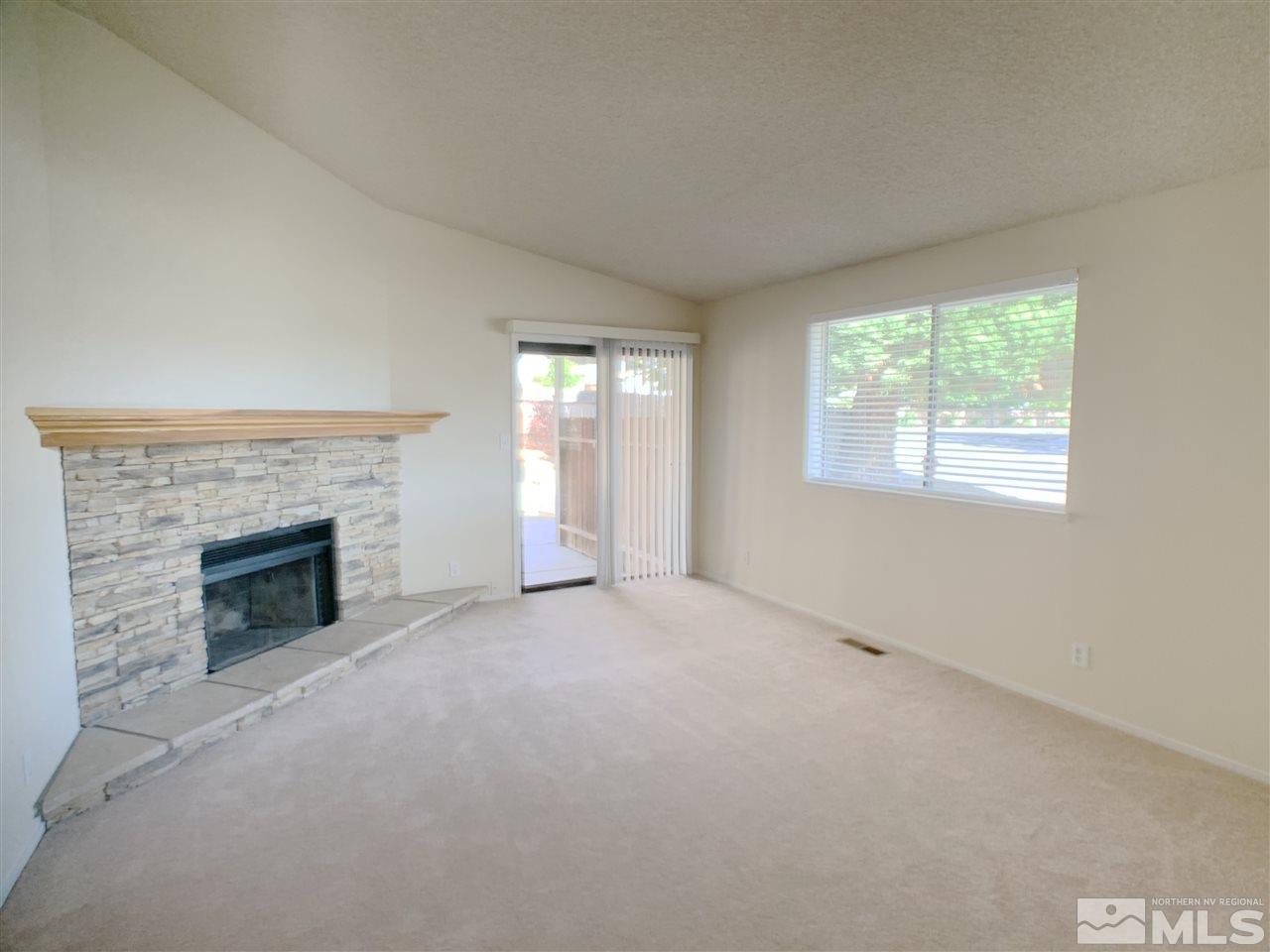 2101 Escalera Way Reno, NV 89523 - Photo 3 of 17 an empty room with windows and fireplace