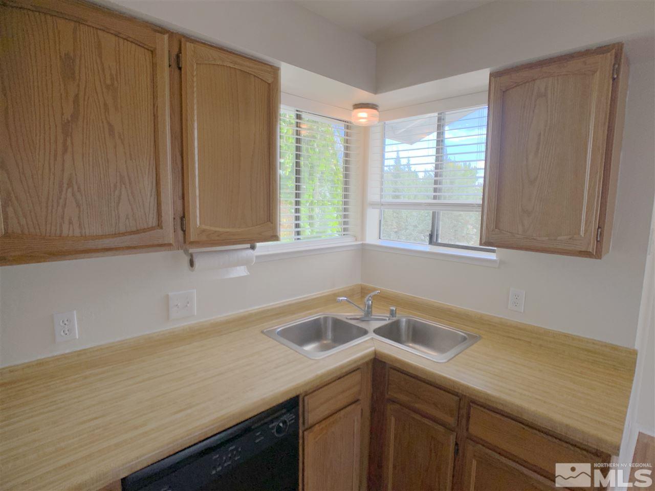 2101 Escalera Way Reno, NV 89523 - Photo 8 of 17 a utility room with a sink a window and cabinets