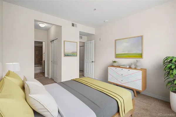 a bedroom with a bed and ceiling fan