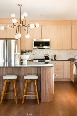 a bathroom with a sink a mirror and next to a window