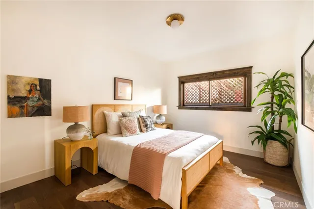 a view of a room with window and wooden floor
