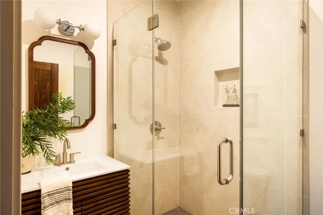 a front view of a house with a garden and a fire pit