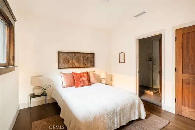 a view of a house of a yard and front view of a house