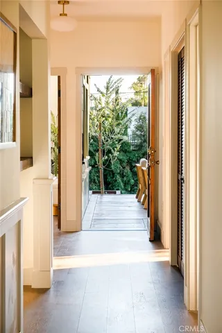 a view of a living room and entryway