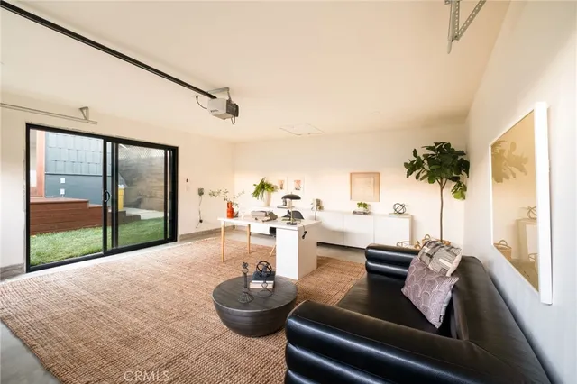 a view of room with furniture and windows