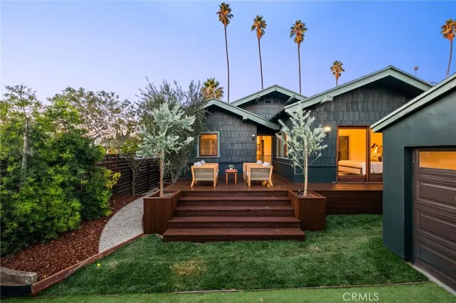 front view of a house with a garden