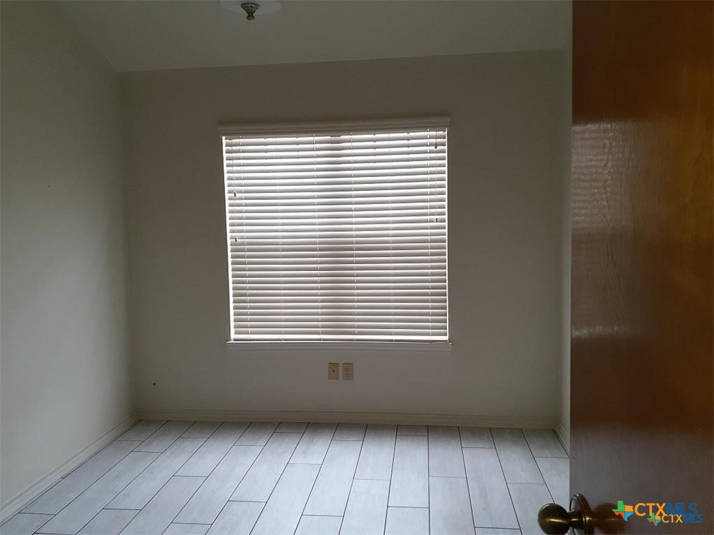 1133 Ashby Street, Unit C9 Seguin, TX 78155 - Photo 18 of 18 a view of an empty room with a window