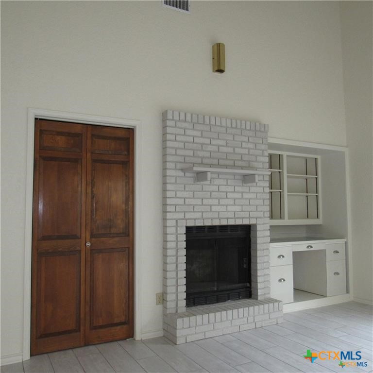 1133 Ashby Street, Unit C9 Seguin, TX 78155 - Photo 3 of 18 a view of empty room with a fireplace