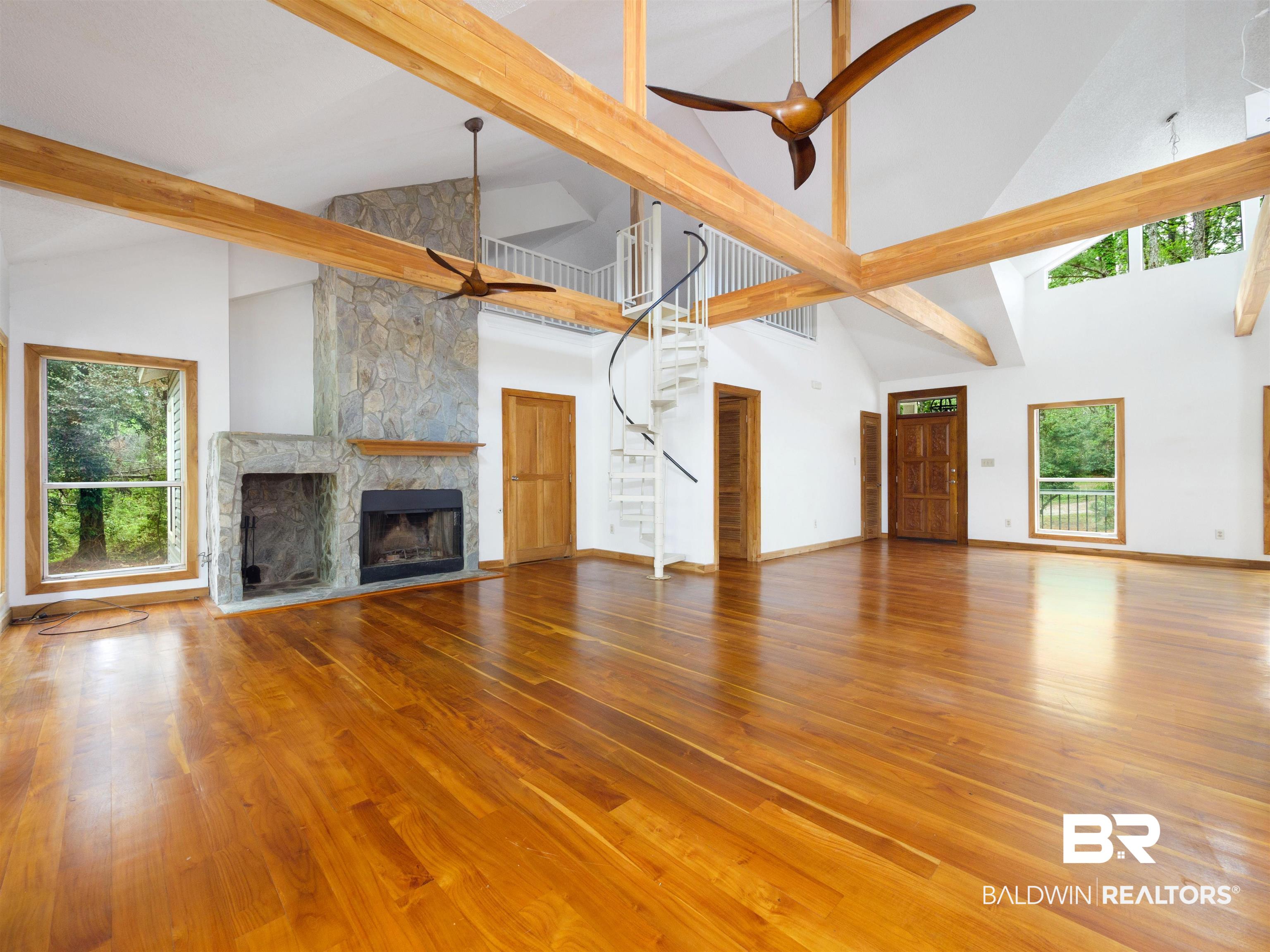 12831 Clay City Road Fairhope, AL 36532 - Photo 8 of 47 Great room has spiral staircase to loft