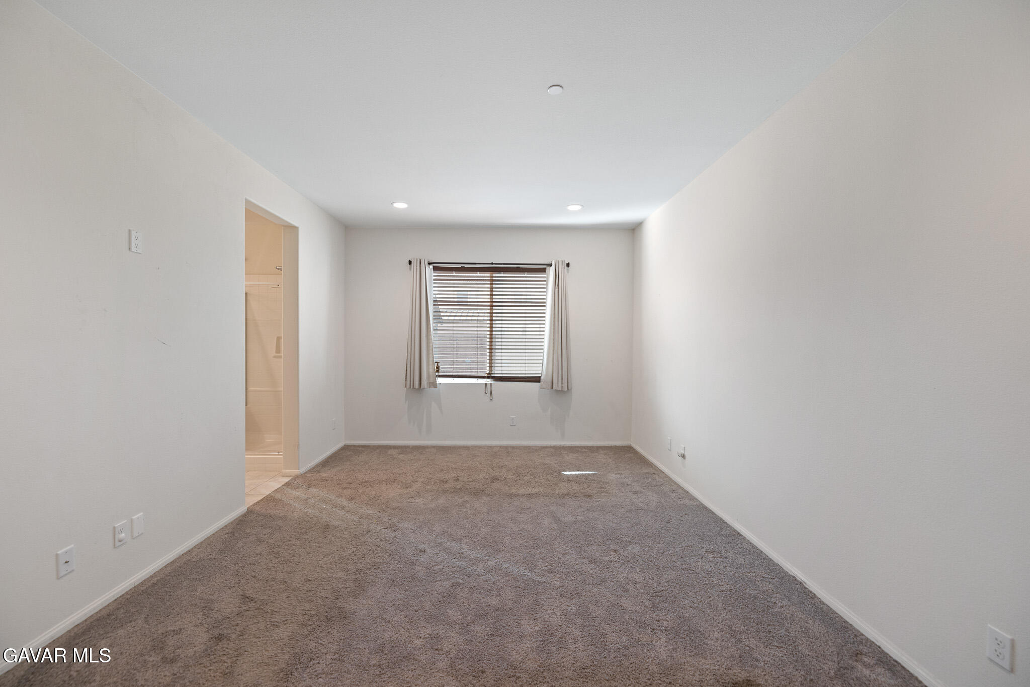 3124 Via Bella Rosa Avenue Rosamond, CA 93560 - Photo 13 of 36 an empty room with windows