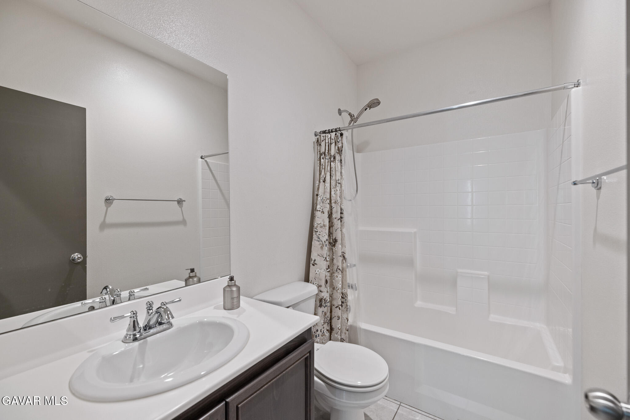 3124 Via Bella Rosa Avenue Rosamond, CA 93560 - Photo 24 of 36 a bathroom with a sink toilet and shower