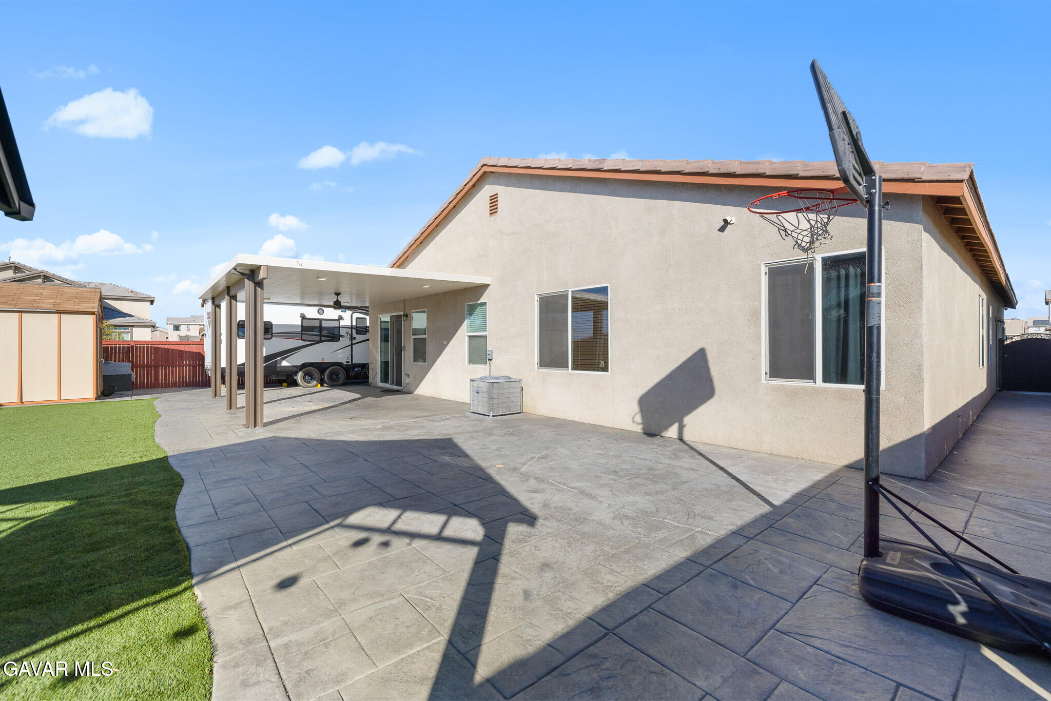 3124 Via Bella Rosa Avenue Rosamond, CA 93560 - Photo 28 of 36 a view of a patio with a table and chairs