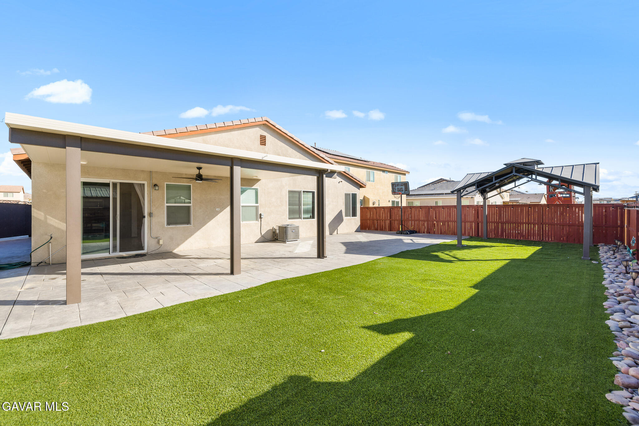 3124 Via Bella Rosa Avenue Rosamond, CA 93560 - Photo 30 of 36 a view of a house with backyard and porch