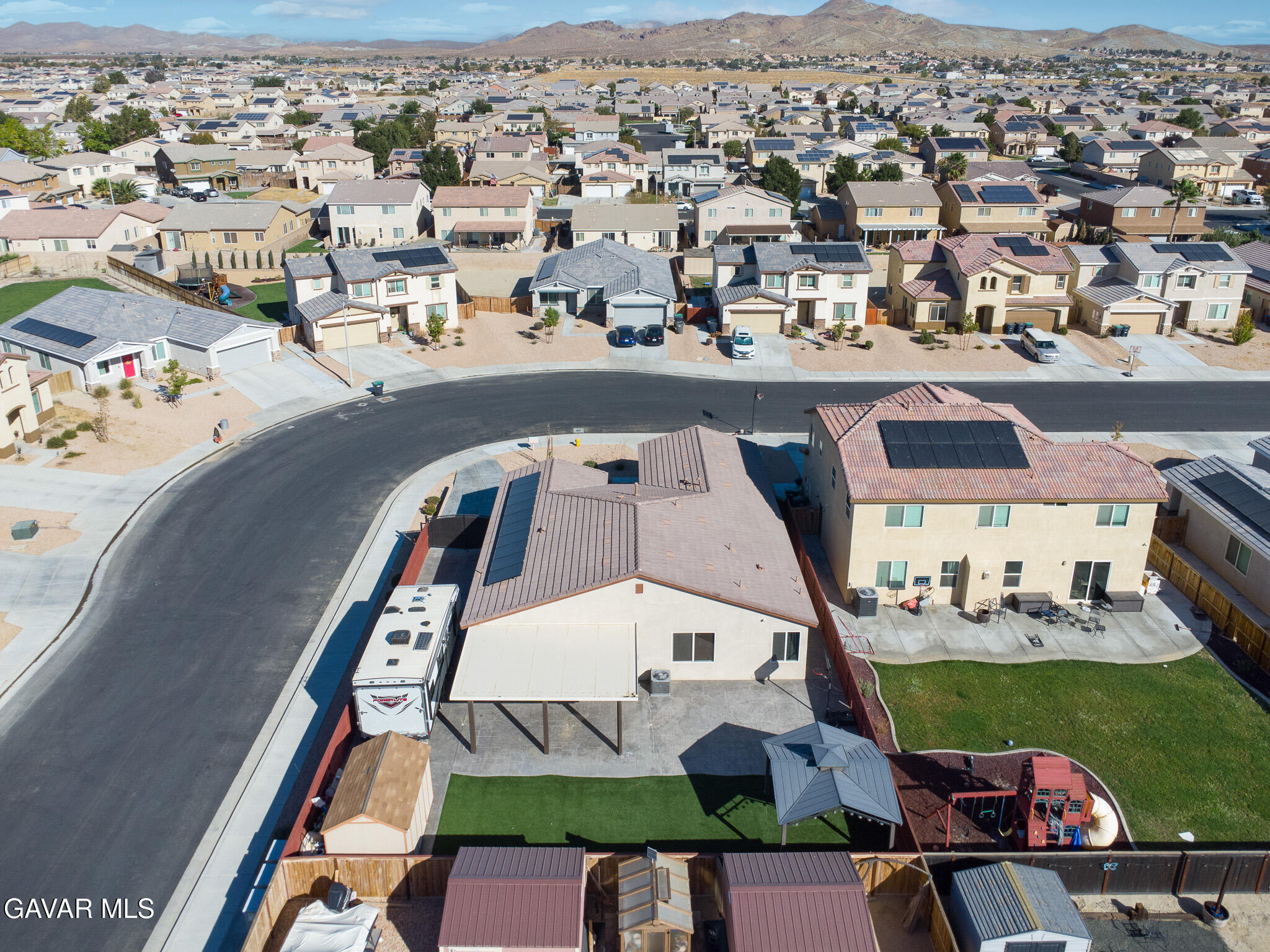 3124 Via Bella Rosa Avenue Rosamond, CA 93560 - Photo 35 of 36 an aerial view of a house with a big yard