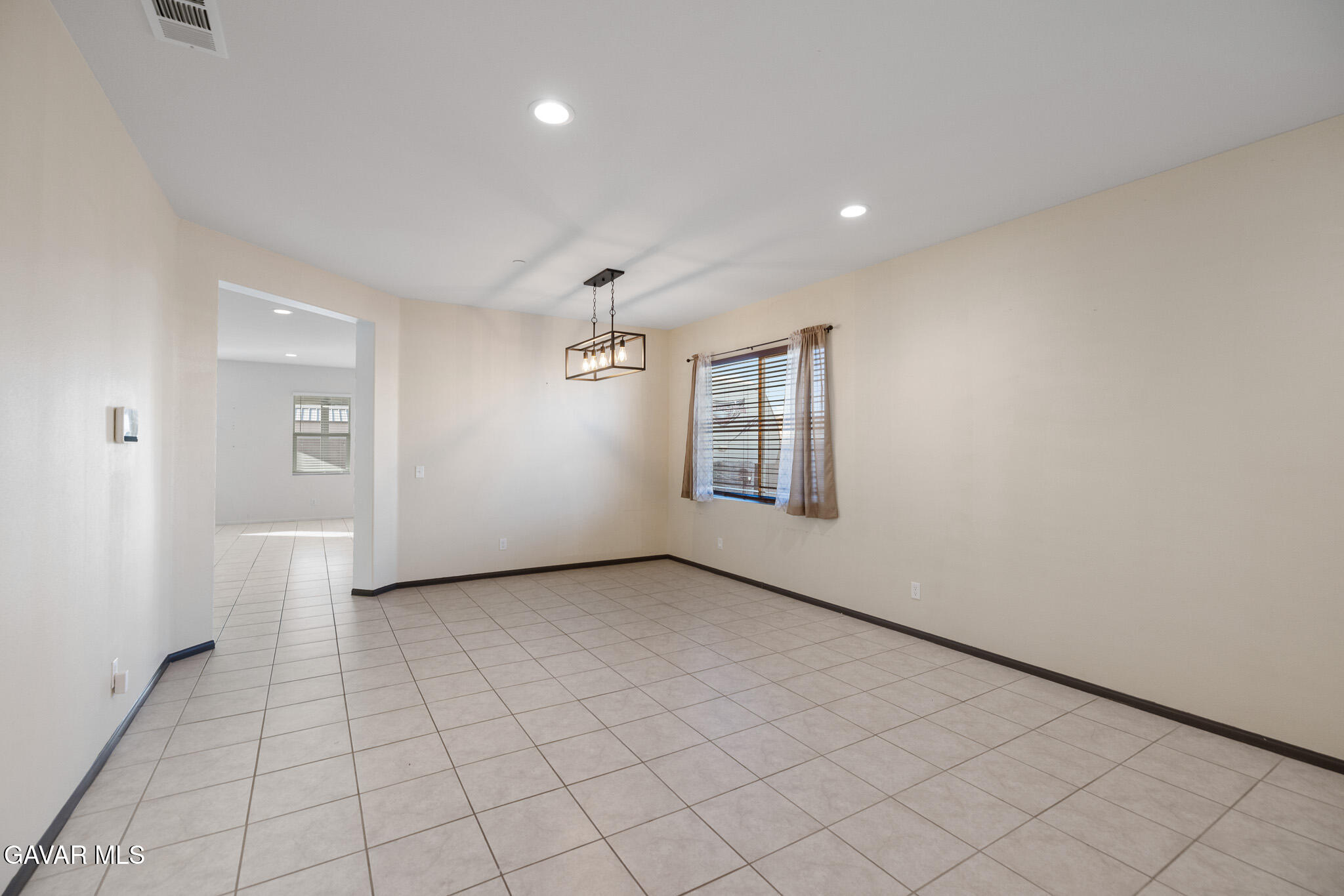 3124 Via Bella Rosa Avenue Rosamond, CA 93560 - Photo 4 of 36 an empty room with windows and closet