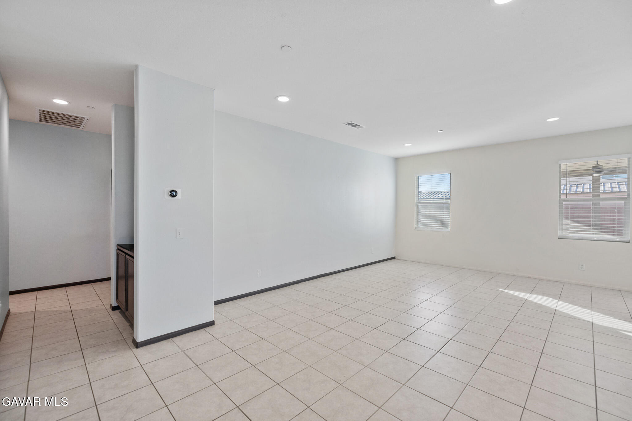 3124 Via Bella Rosa Avenue Rosamond, CA 93560 - Photo 6 of 36 an empty room with windows and closet