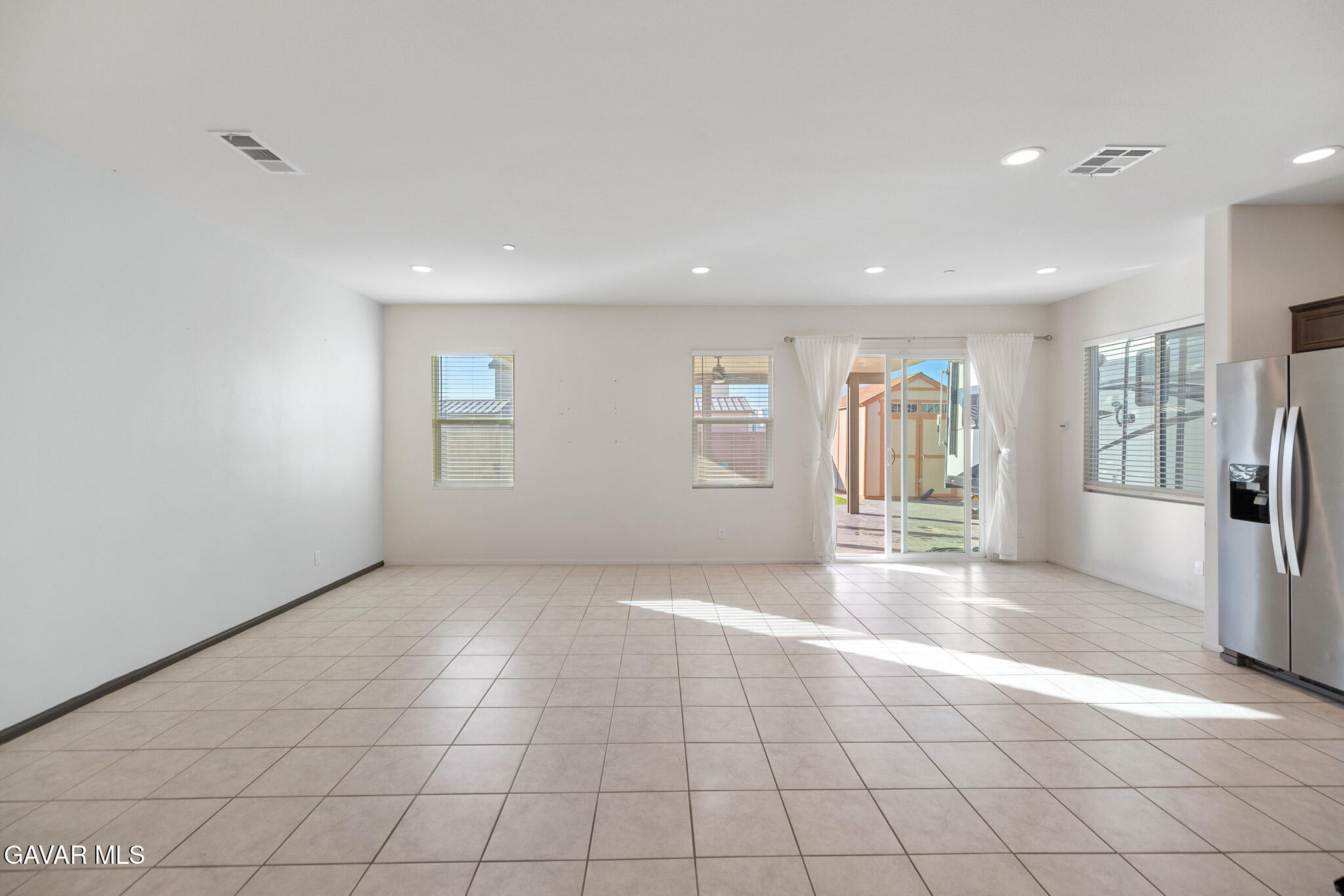 3124 Via Bella Rosa Avenue Rosamond, CA 93560 - Photo 7 of 36 a view of an empty room with a window