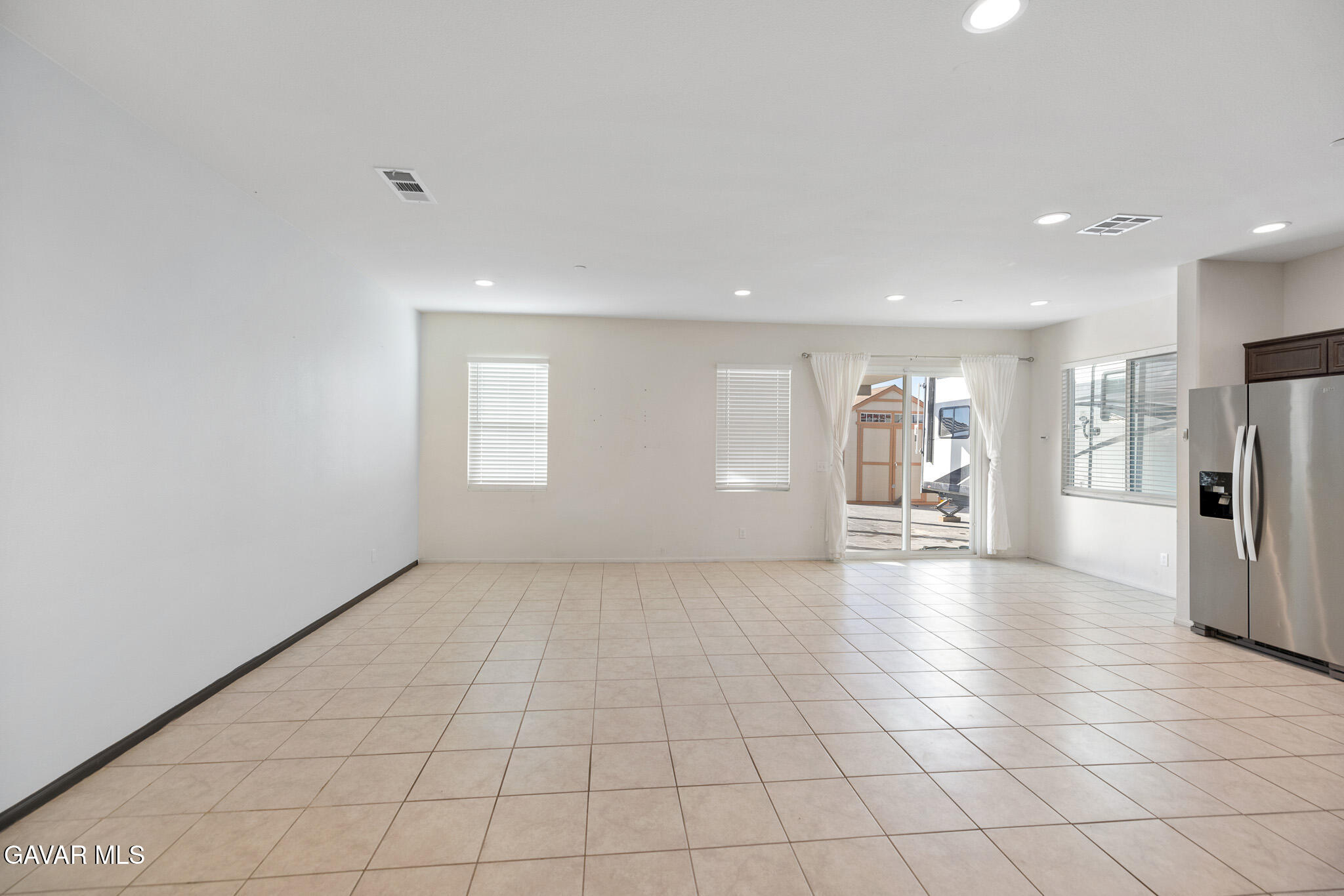 3124 Via Bella Rosa Avenue Rosamond, CA 93560 - Photo 9 of 36 a view of an empty room with a window