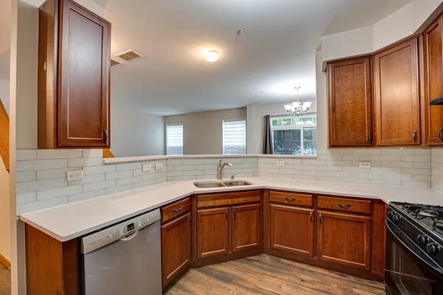 a kitchen with a sink and cabinets