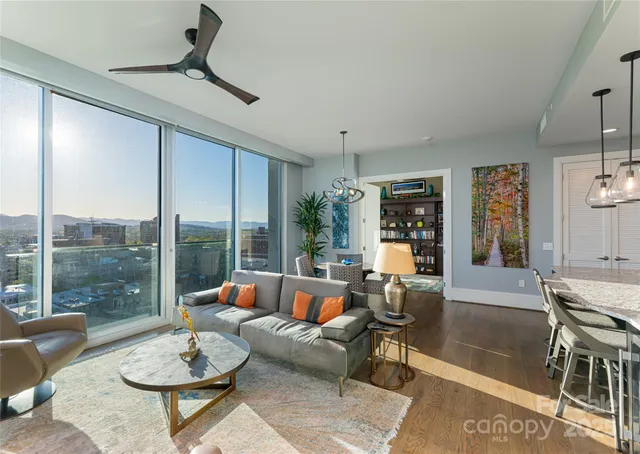 a kitchen with a table a sink and cabinets