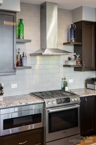 a spacious bedroom with a large bed and a potted plant