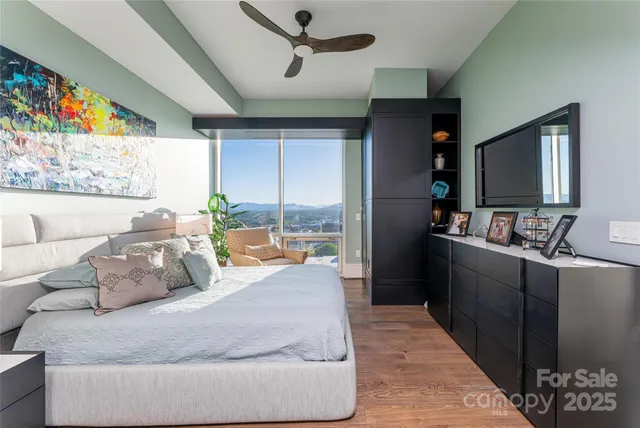 a bathroom with a mirror a double vanity sink and glass door