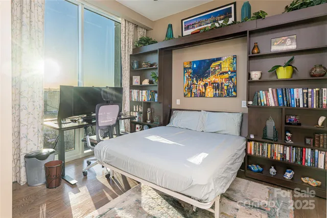 a bathroom with a granite countertop toilet a sink a mirror and shower