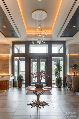 a room with lots of furniture and a large window