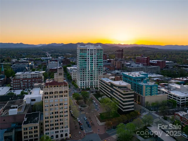 a lobby with furniture and potted plant