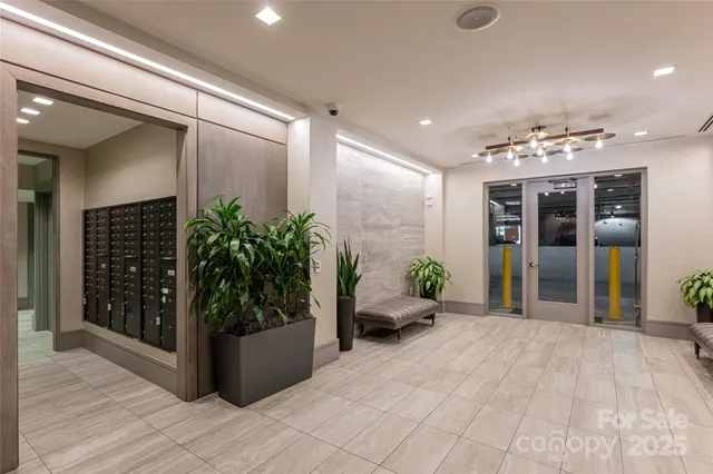 a room with furniture and wall paintings