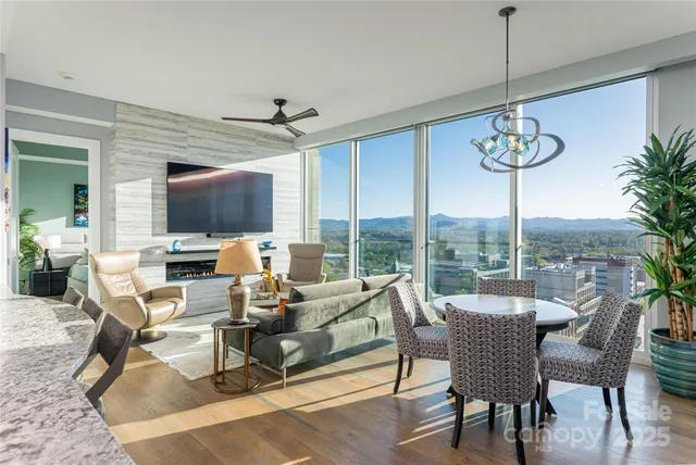 a large kitchen with a table and chairs