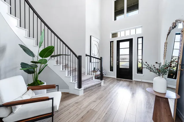 a view of entryway with wooden floor and a potted plant