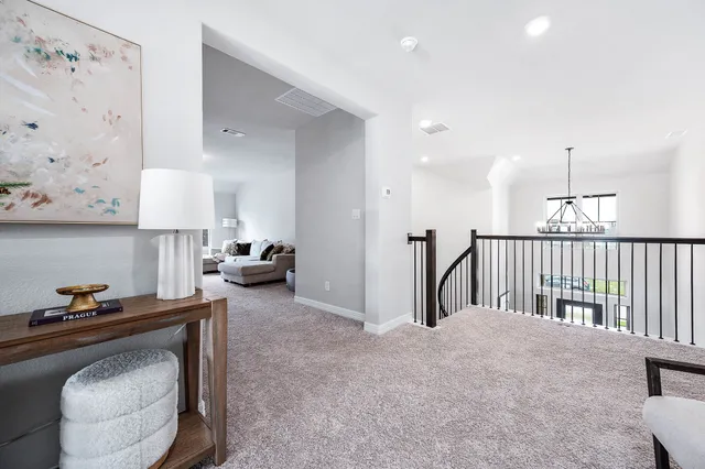 a living room with furniture and a lamp