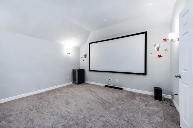 a bedroom with bed and a window