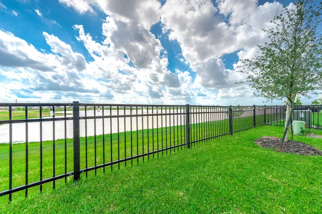 a view of a patio with table and chairs and potted plants