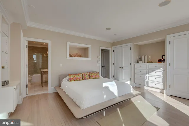 a bedroom with a bed and a table