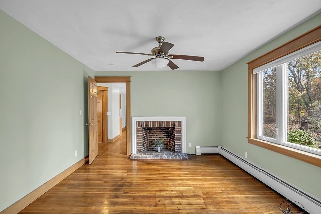 15 Stagecoach Road Topsfield, MA 01983 - Photo 15 of 40 a view of an empty room with window and chandelier fan