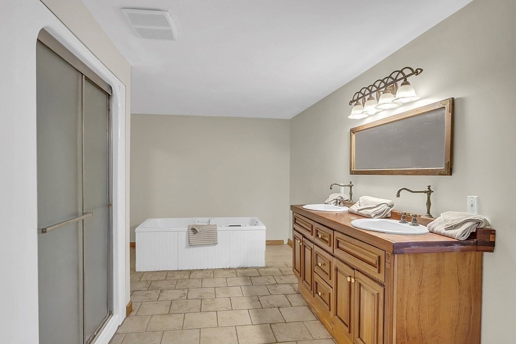 15 Stagecoach Road Topsfield, MA 01983 - Photo 21 of 40 a bathroom with a sink a toilet and mirror