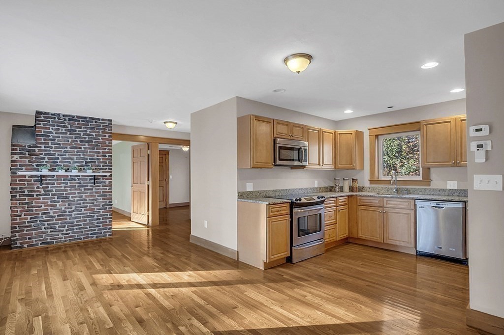 15 Stagecoach Road Topsfield, MA 01983 - Photo 28 of 40 a kitchen with stainless steel appliances granite countertop a stove and a sink